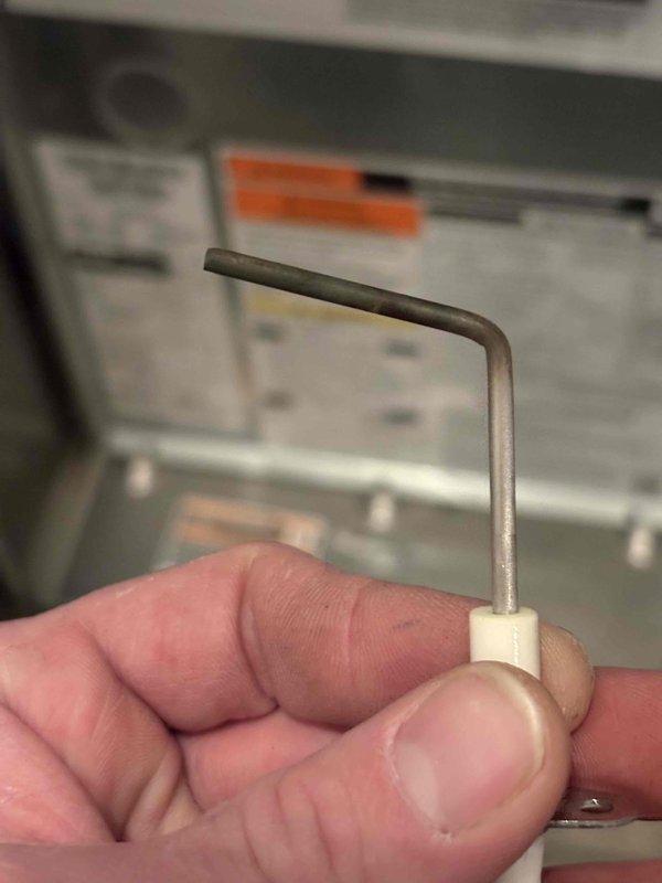 Performed annual heating tune-up on residential furnace, arriving within scheduled window. Inspected system components using Allen wrench and examined burner assembly with multiple ports. No issues detected with the heating system; noted customer does not have humidifier despite being on service club.