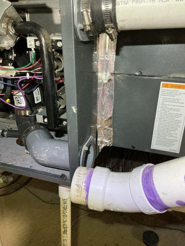 Responded to no-heat call for system previously serviced for drainage issues. Upon inspection of the furnace, identified failed pressure switch causing system lockout. Cleaned condensate drain line and reset system, restoring proper operation. Verified all connections and documented condition with photos of internal components and drainage system.