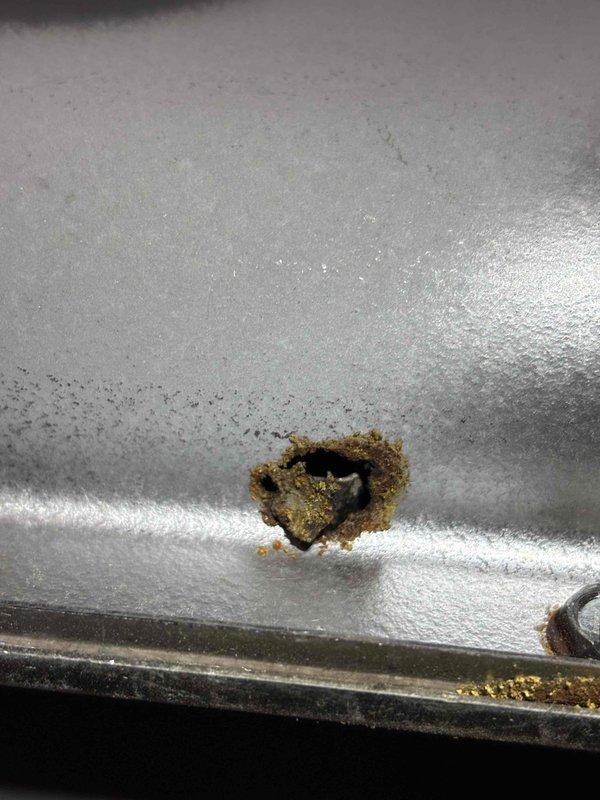 Completed quoted repair for heat exchanger (HTX) replacement. Visual inspection revealed metal component with significant perforation and surrounding corrosion damage. Removed damaged unit, installed new heat exchanger, and verified proper operation before completing service.