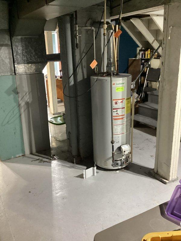 Conducted comprehensive water heater replacement estimate in basement utility area. Inspected existing unit, which shows signs of age with visible wear on metal surfaces and connections. Documented complete setup including piping configuration, electrical connections, and surrounding clearances for proper quote preparation. Photos taken for reference to ensure accurate sizing and installation requirements.