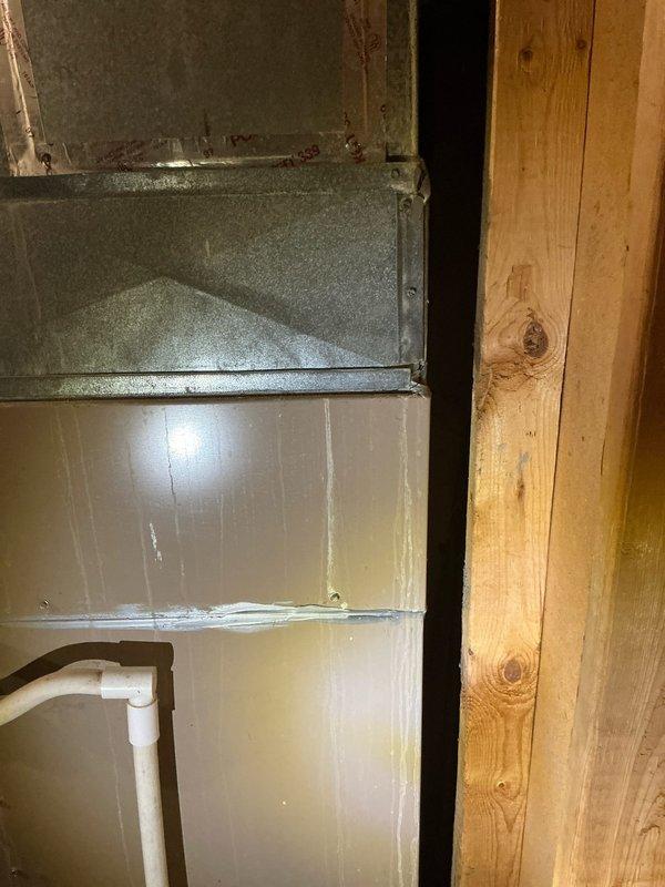 Completed furnace estimate for 16-year-old unit replacement. Inspected existing ductwork and ventilation system, noting aged metal piping with insulation and visible cobwebs in the framing structure. Documented galvanized ductwork condition and PVC venting configuration for proper system sizing and installation requirements.