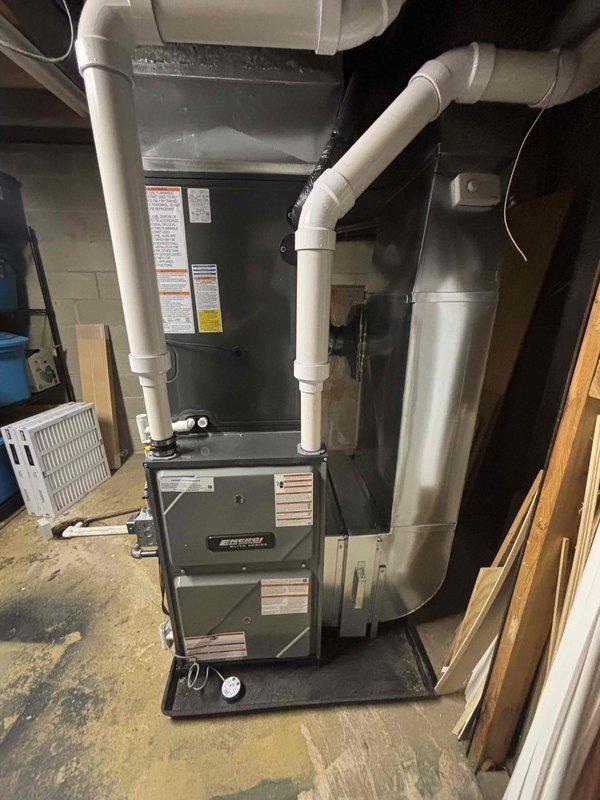 Successfully installed new furnace and air conditioning system in basement utility area. System includes properly connected white PVC ventilation ducts and all required ductwork. Michigan Saves financing paperwork completed and submitted through DocuSign.