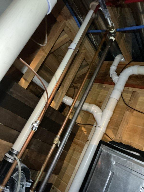 Conducted comprehensive water heater replacement estimate in residential basement. Inspected existing plumbing infrastructure including copper and PVC piping configurations. Documented current installation with photos showing utility area layout and connection points for proper sizing and installation requirements of new unit. Provided quote to customer for complete water heater replacement service.