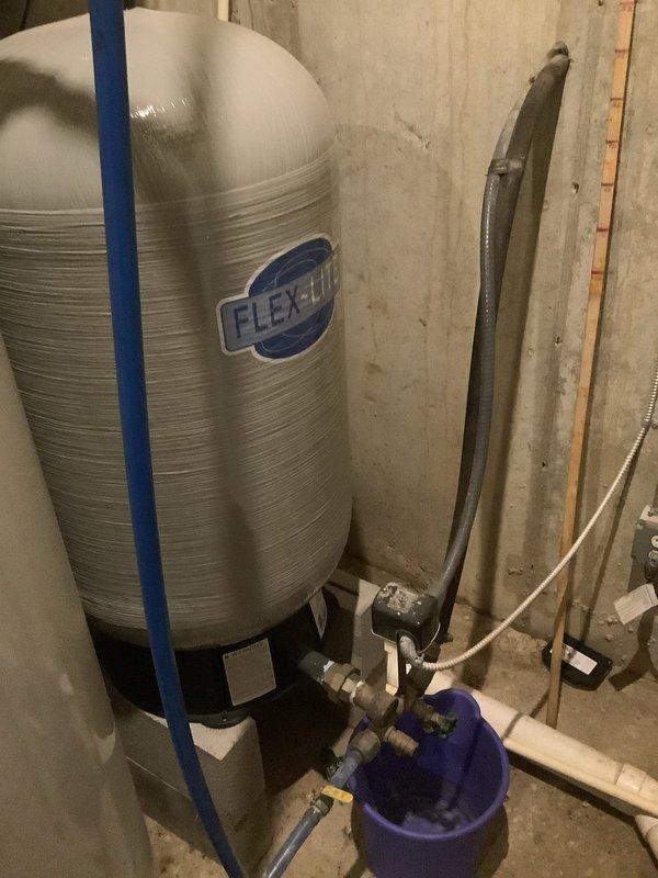 Conducted a comprehensive assessment and repair of two faucets, along with inspection of a toilet and garbage disposal as requested by client. Examined mechanical room infrastructure including copper piping system with circulation pumps, valves, and expansion tank to ensure proper water flow. Inspected residential water treatment system including FLEX-LITE pressure tank and associated plumbing connections to verify optimal functionality for the repaired fixtures.