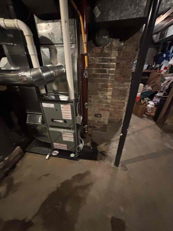 Successfully completed installation of new Amana furnace in basement utility room, properly connecting all necessary ductwork, PVC venting, and ensuring optimal placement alongside existing water heater. System was fully tested and verified operational with proper airflow through the newly installed components.