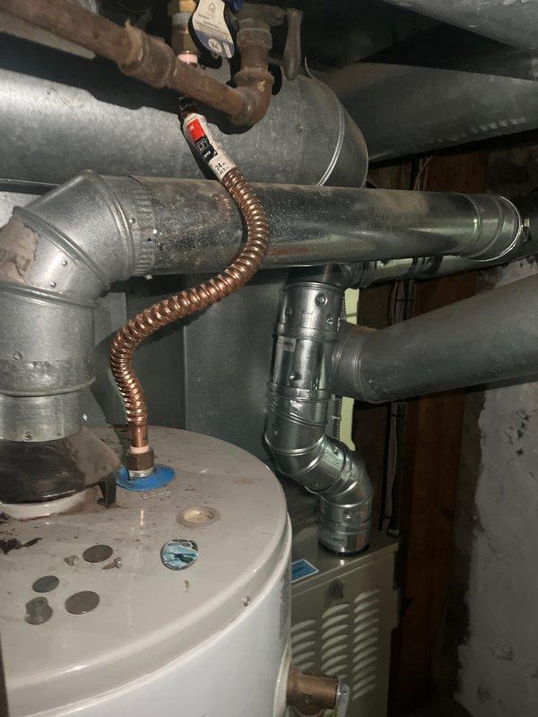 Successfully installed a new Carrier furnace unit in the utility room, complete with proper connection to existing ductwork system. All ventilation components were secured with appropriate metal fasteners, and system was verified to be in normal working condition with no leaks or abnormalities.