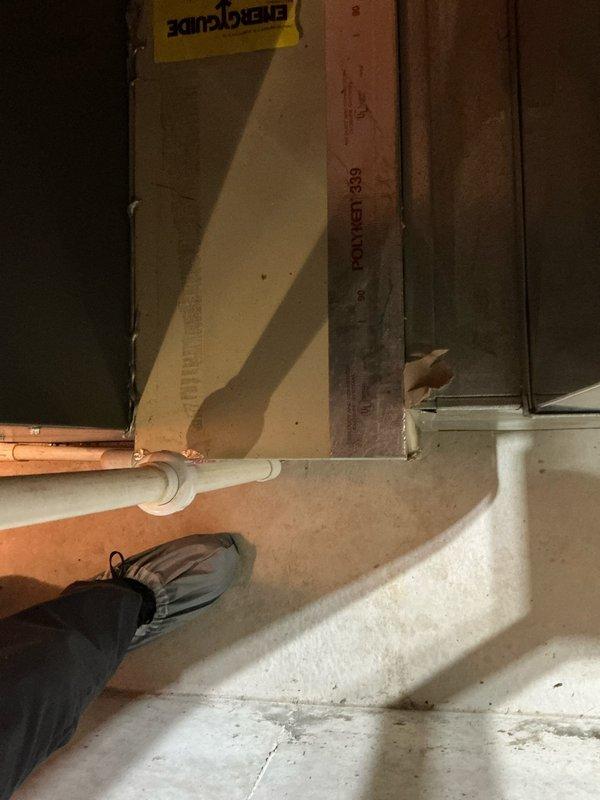 Completed routine furnace tune-up on 17-year-old Energi system. Identified failed heat exchanger requiring replacement. Documented condition with photos of the furnace installation area and surrounding utility space.