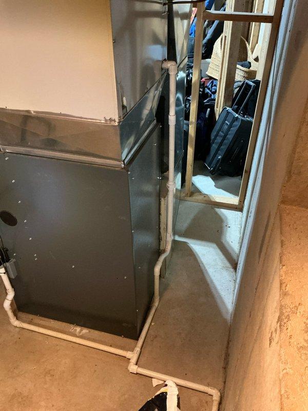 Completed routine furnace tune-up on 17-year-old Energi system. Identified failed heat exchanger requiring replacement. Documented condition with photos of the furnace installation area and surrounding utility space.