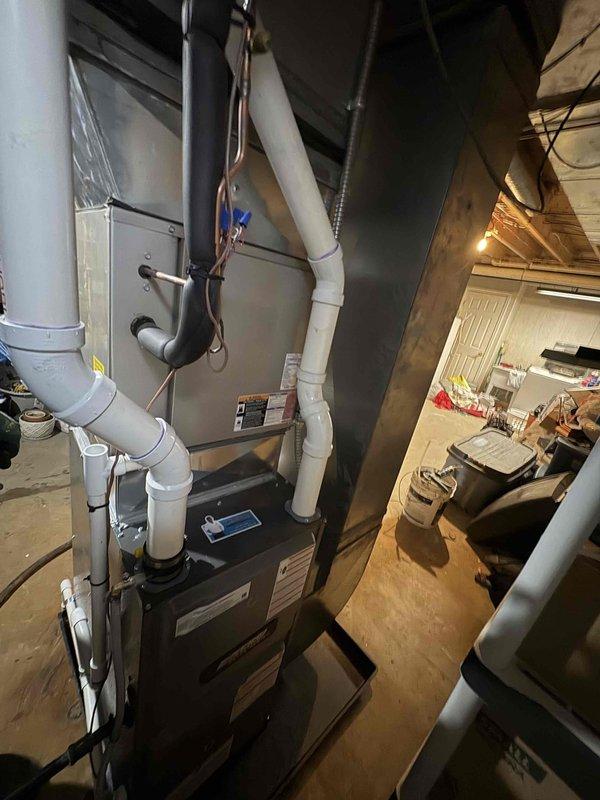 Successfully completed installation of new furnace unit in basement utility room, including proper connection of intake/exhaust PVC pipes, condensate drainage system, and integration with existing ductwork. All electrical connections were properly secured, and the system was tested for proper operation with the adjacent water heater.