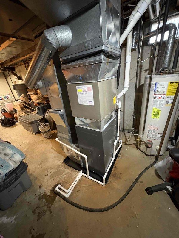Successfully completed installation of new furnace unit in basement utility room, including proper connection of intake/exhaust PVC pipes, condensate drainage system, and integration with existing ductwork. All electrical connections were properly secured, and the system was tested for proper operation with the adjacent water heater.