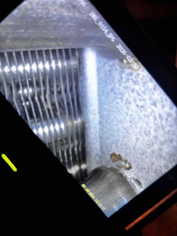 Performed annual heating tune-up on 15-year-old furnace system. Inspected heat exchanger and cooling coils, which showed normal wear patterns with some minor surface deposits on the metal fins. System is functioning properly with next maintenance due in 2025.