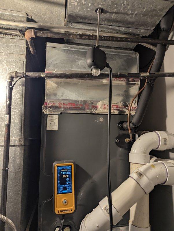Completed annual heating tune-up on 16-year-old Trane furnace system. Performed diagnostic testing with readings of 119.4/20.2 and inspected ventilation/drainage components. Noted significant discoloration and possible mold growth in ductwork that requires attention.
