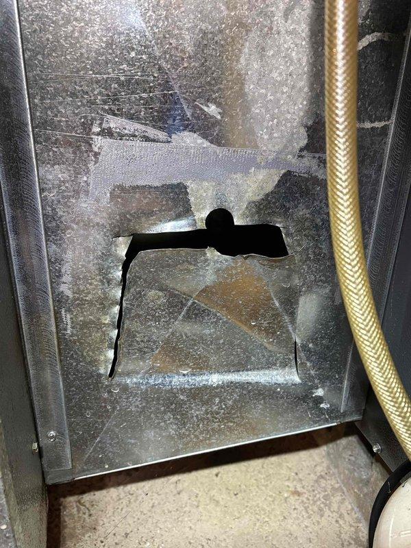 Diagnosed short cycling issue on 14-year-old EnergiAir furnace. Identified damaged access panel with improvised cutout and inspected wiring connections. Repaired electrical components and restored proper cycling operation to resolve partial heating problem.