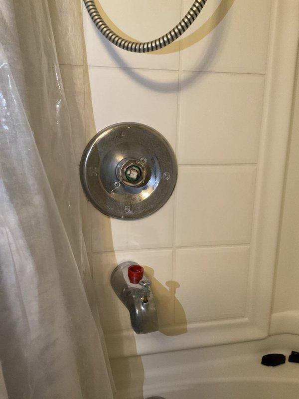 Replaced the existing tub shower faucet in a vintage home (built 1896) that had developed operational issues. Removed worn components and installed new chrome fixture set, including control valve and bathtub spout with proper hot/cold indicators. Verified proper function with no leaks after installation.