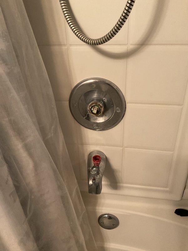 Replaced the existing tub shower faucet in a vintage home (built 1896) that had developed operational issues. Removed worn components and installed new chrome fixture set, including control valve and bathtub spout with proper hot/cold indicators. Verified proper function with no leaks after installation.