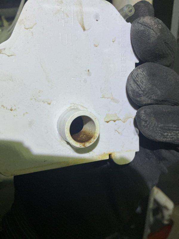 Diagnosed 13-year-old ICP furnace with no heat condition. Physical inspection revealed significant contamination and sediment buildup in the condensate collection system, evidenced by discolored trap components with visible brownish residue. Performed necessary maintenance to restore proper system operation.
