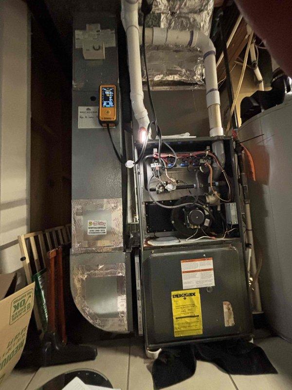 Responded to water leak service call for 18-year-old GDM furnace. Diagnosed leak originating from the exhaust vent connection and collector box. Performed inspection with diagnostic tools to verify issue and documented condition with photos of the HVAC system including PVC ventilation piping and internal furnace components.