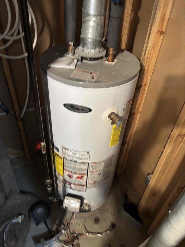 Diagnosed and repaired Whirlpool water heater (approximately 7 years old) that was not producing hot water due to ignition failure. Successfully restored proper ignition and verified normal operation, ensuring adequate hot water supply for customer.