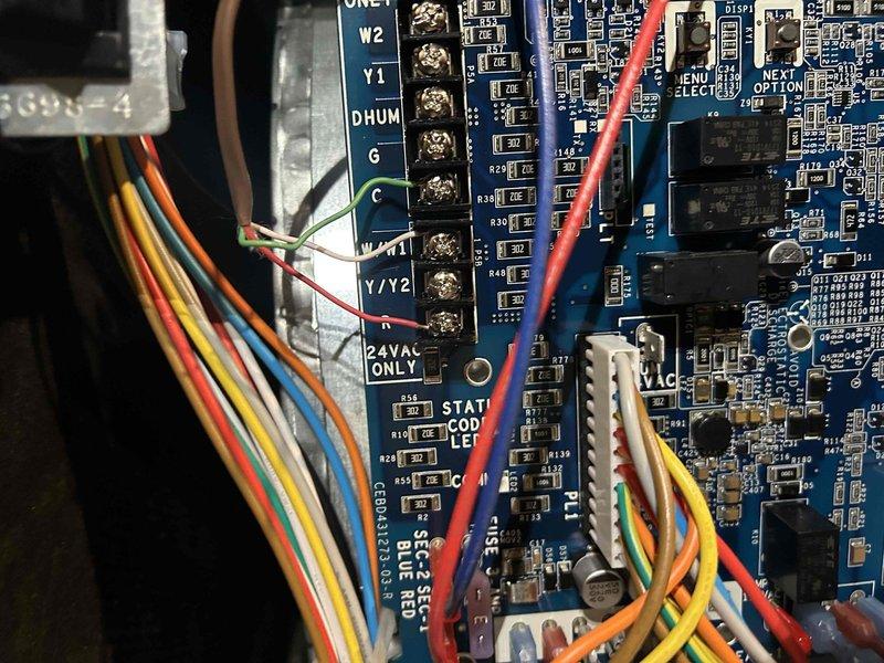 Responded to no heat call for 0-year-old furnace. Diagnosed faulty control board as evidenced by terminal connection issues. Replaced control board and reconnected all wiring to proper terminals (W2, Y1, DHUM, G, C, W1, Y1/Y2), restoring proper system operation.