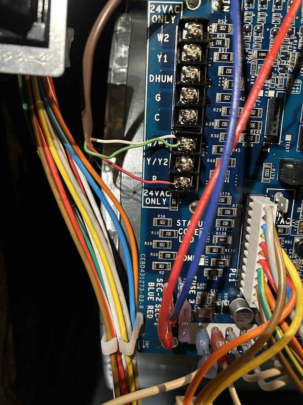 Responded to no heat call for 0-year-old furnace. Diagnosed faulty control board as evidenced by terminal connection issues. Replaced control board and reconnected all wiring to proper terminals (W2, Y1, DHUM, G, C, W1, Y1/Y2), restoring proper system operation.