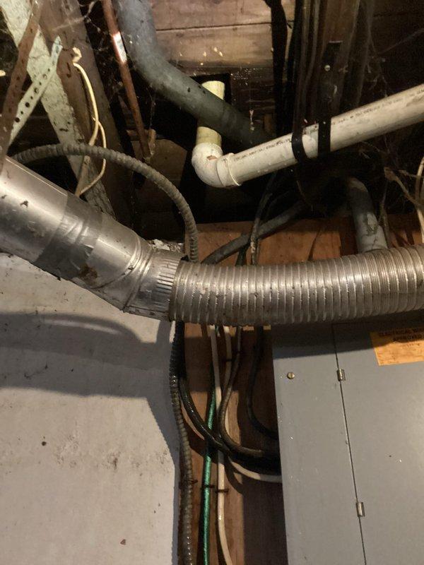 Delivered and dropped off space heaters to customer site. Inspected existing HVAC system components including flexible aluminum ductwork, PVC piping, and electrical connections in the utility area to determine appropriate heater placement.