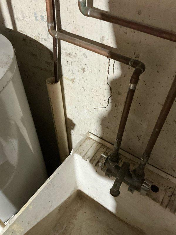 Responded to service call for a non-functioning furnace with blank thermostat. Upon inspection, found thermostat had no batteries installed. Inspected water heater installation and surrounding plumbing infrastructure while on site, noting Bradford White units with proper venting and copper supply lines in good working condition.