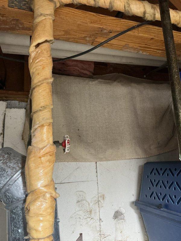 Conducted an estimate for tankless water heater replacement, evaluating the existing cylindrical unit located in utility area. Documented current installation, including copper piping, brass fittings, and ventilation requirements. Noted Club Membership status valid through May 2026. Photos captured both the current water heater setup and surrounding utility space with exposed structural elements to facilitate accurate quote preparation.