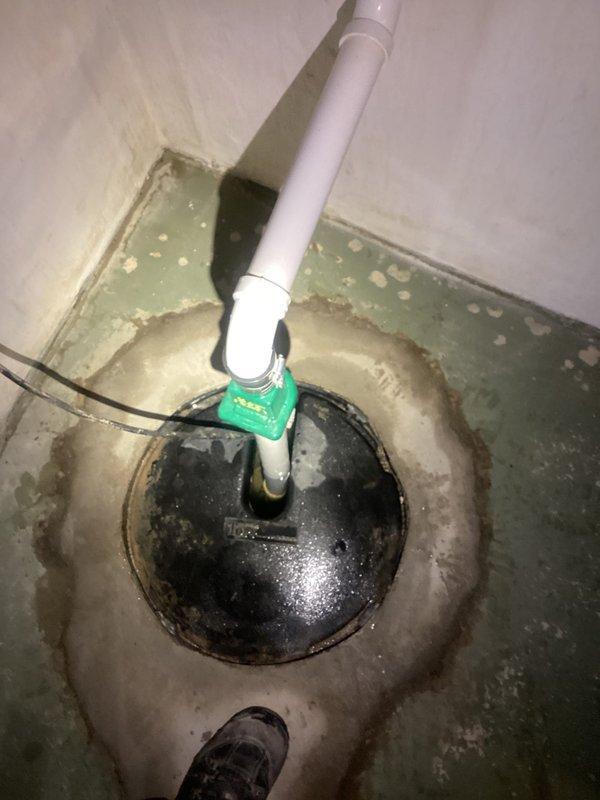 Diagnosed and replaced a non-functioning sump pump in basement where the crock was full and unit was not activating. Installed new pump with proper electrical connections and verified discharge line integrity through the existing PVC piping system. System now operating correctly with proper water evacuation from the sump pit.
