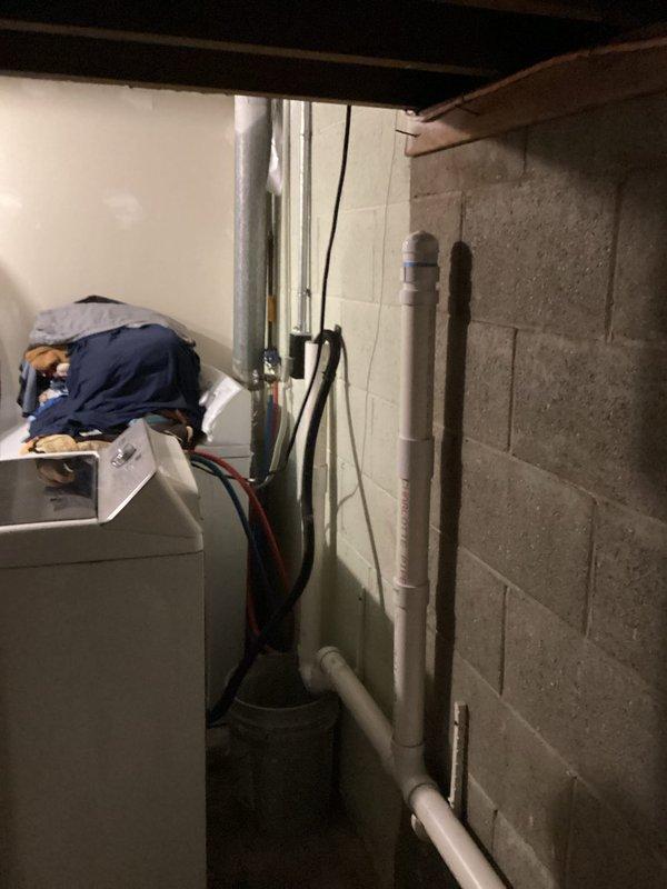 Responded to recurring drain backup issue in basement utility area. Performed drain cleaning service on PVC drainage system connected to washing machine. Successfully cleared blockage and verified proper drainage function, resolving the backup problem that had previously been serviced.