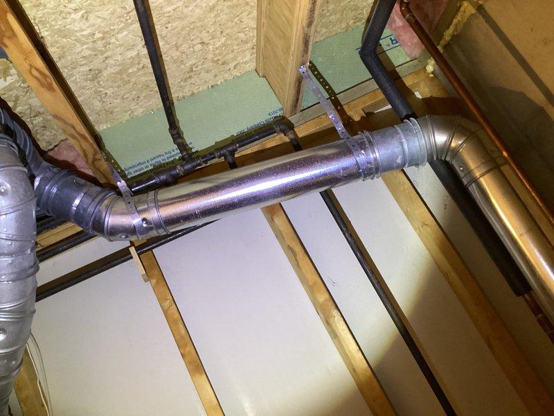 Performed annual maintenance on 17-year-old furnace system. Inspected ductwork in utility area, confirming proper installation of galvanized metal ducts with no visible damage or deterioration. Verified connections at elbow joints were secure with all seams intact.