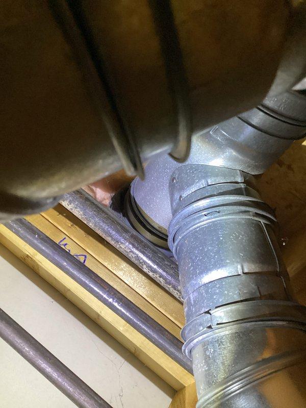 Performed annual maintenance on 17-year-old furnace system. Inspected ductwork in utility area, confirming proper installation of galvanized metal ducts with no visible damage or deterioration. Verified connections at elbow joints were secure with all seams intact.