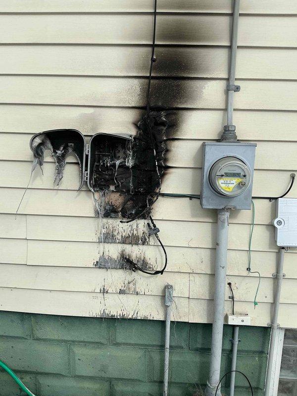 Responded to emergency call regarding non-functioning basement circuits and furnace. Inspection revealed a severely fire-damaged exterior electrical box with extensive charring and melting that had compromised the connection to the main panel. Replaced damaged components, rewired affected circuits, and restored power to basement and furnace after confirming safe operation of the electrical system.
