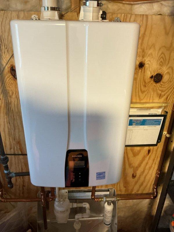 Performed annual maintenance on Navien tankless water heater including complete system flush to remove mineral buildup. Serviced filtration components, checked all connections, and verified proper operation of the unit. System is now functioning optimally with restored efficiency as confirmed by final diagnostic check.