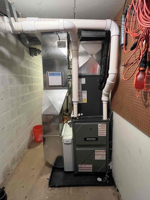 Successfully completed installation of new furnace and AC system at residential property. Installed outdoor condensing unit on concrete pad with proper electrical connections, and mounted indoor furnace unit on platform with PVC intake/exhaust ventilation system. All components properly installed, tested, and verified operational with client.