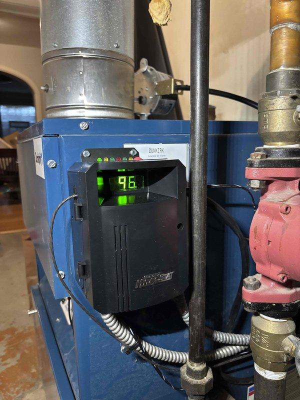 Returned to service Duratex boiler system showing 96% efficiency reading. Performed previously quoted repairs, including replacement of corroded copper piping and electrical connections. System is now operational with all components properly secured and tested.