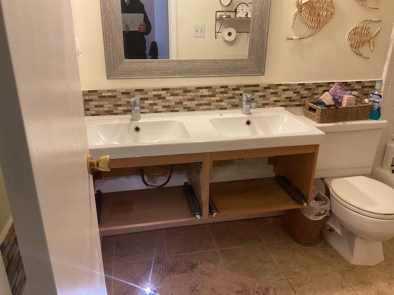 Successfully repaired dual-sink vanity with right faucet leak and left sink slow water flow issues. Disassembled and serviced both faucet assemblies, replacing worn components and clearing mineral buildup to restore proper water pressure and eliminate leakage.