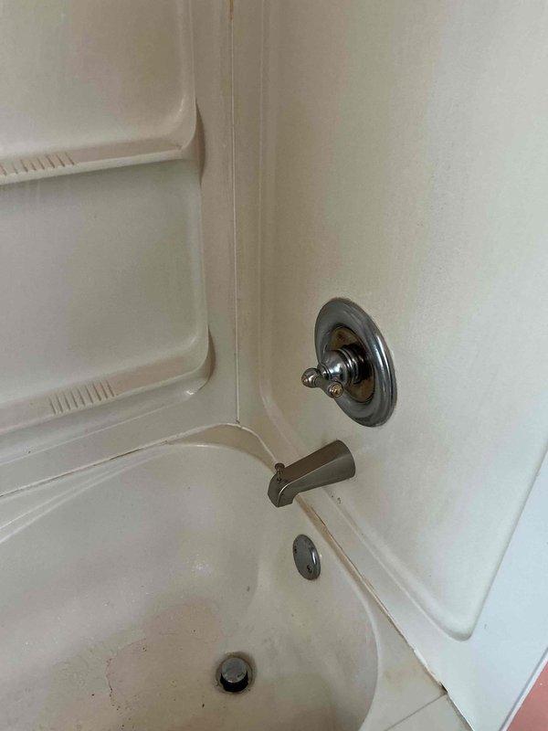 Diagnosed and repaired shower diverter issue in 70+ year old home's bathtub fixture, where water was continuing to flow from tub spout when shower activation was attempted. Replaced worn diverter mechanism in the tub spout, restoring proper water flow diversion to shower head and eliminating the dual-flow problem that had been worsening over the past month.