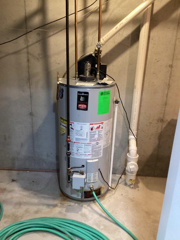 Performed comprehensive assessment of existing water heater installation in basement utility area, documenting current configuration with photographs. Evaluated copper supply lines, PVC drainage/ventilation components, and electrical connections to determine appropriate replacement options. Provided estimate for water heater replacement based on inspection findings (CWOW reference #231-343-3294, CM 2024).