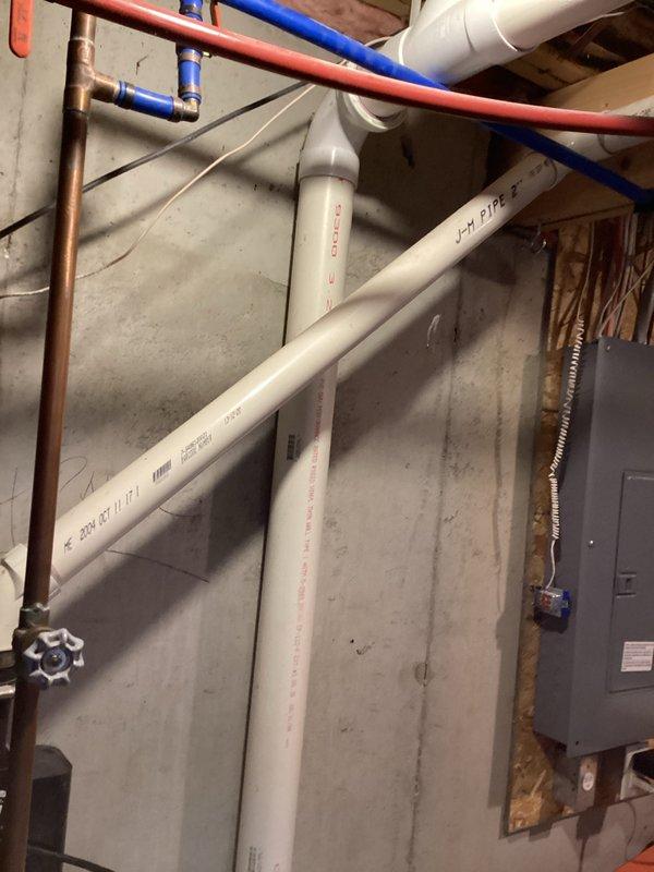 Performed comprehensive assessment of existing water heater installation in basement utility area, documenting current configuration with photographs. Evaluated copper supply lines, PVC drainage/ventilation components, and electrical connections to determine appropriate replacement options. Provided estimate for water heater replacement based on inspection findings (CWOW reference #231-343-3294, CM 2024).