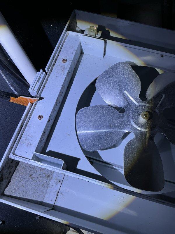 Completed annual heating service on a 12-year-old furnace and humidifier system. Inspected air handling unit, noting dust accumulation on the fan blades and housing. Observed some debris and discoloration on the filter frame and mesh, suggesting regular maintenance is required to maintain optimal system performance.