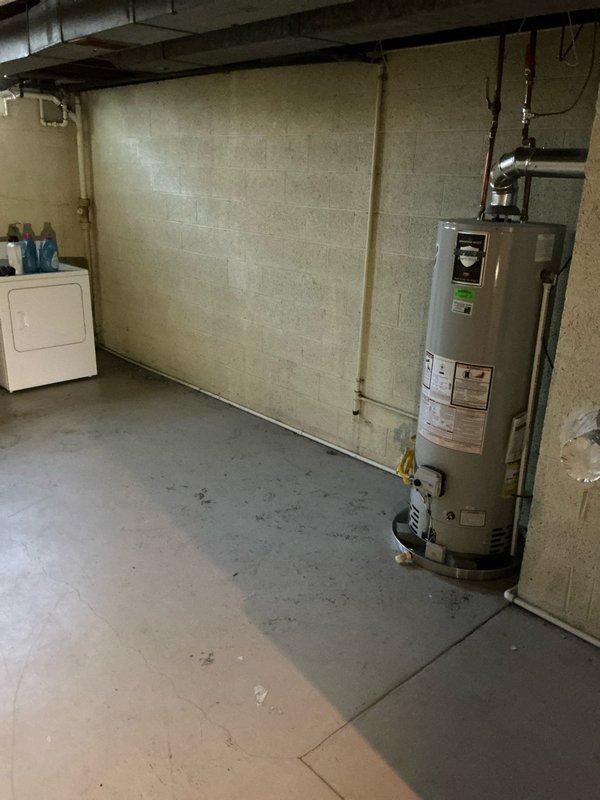 Conducted comprehensive assessment of existing HVAC system, including furnace and AC unit located in basement utility room. Documented current installation configuration (furnace with PVC venting, round metal ductwork) and evaluated cooling performance issue regarding insufficient cold air output from AC. Provided estimate for furnace and AC replacement options and discussed Nest thermostat installation requirements with customer.