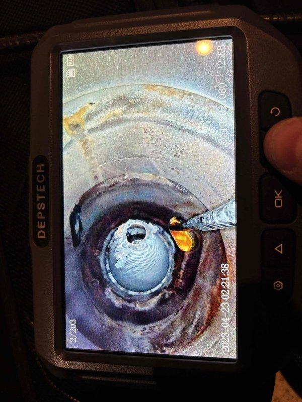 Performed complimentary annual boiler tune-up on 16-year-old system with CM from 2020. Inspection revealed significant copper pipe corrosion with rust and teal-colored oxidation at solder joints. Used DEPSTECH camera to examine interior piping, documenting extensive internal corrosion and sediment buildup that requires attention.