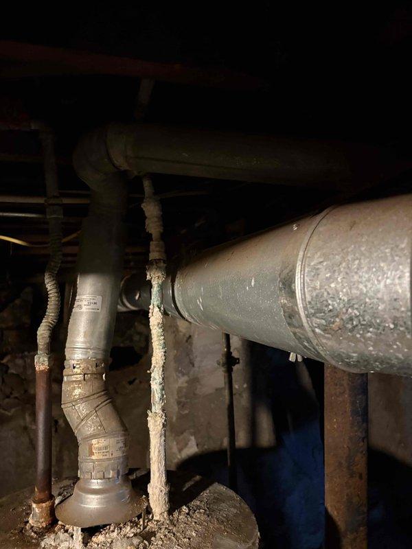 Responded to reported gas leak concern at property. Upon inspection of the gas lines and connections in the crawlspace/basement area, identified corrosion at copper-to-PVC pipe transition point with signs of deterioration in the sealant material. Performed comprehensive gas leak detection throughout the system, focusing on the corroded connection and surrounding HVAC ductwork. Tested furnace (15 years old) for proper operation and gas supply integrity.