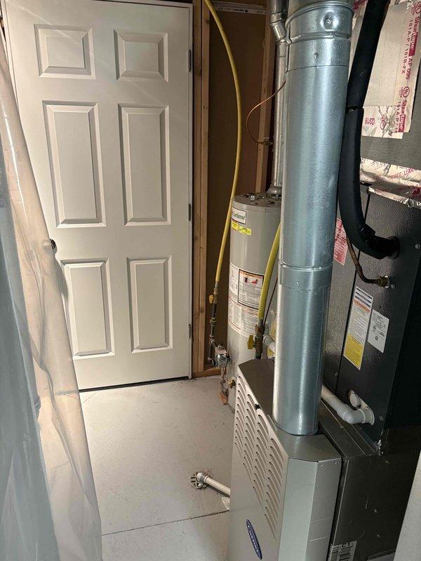 Completed diagnostic assessment of 16-year-old water heater with temperature regulation issues. Unit is still functional but showing age-related performance decline. Provided customer with replacement options and quote as requested, documenting current installation configuration with photos for proper sizing of potential replacement unit.