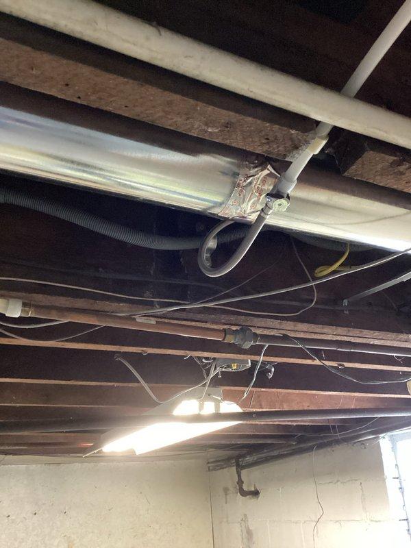 Successfully completed dishwasher drain installation by connecting new 13' PVC line to existing 2" drain system. Installed approximately 10' of new PEX water lines tied into existing 3/4" hot water supply with new local shutoff valve. Added ice maker supply line connected to existing 3/4" cold water line, with all connections properly secured to joists in unfinished ceiling area.