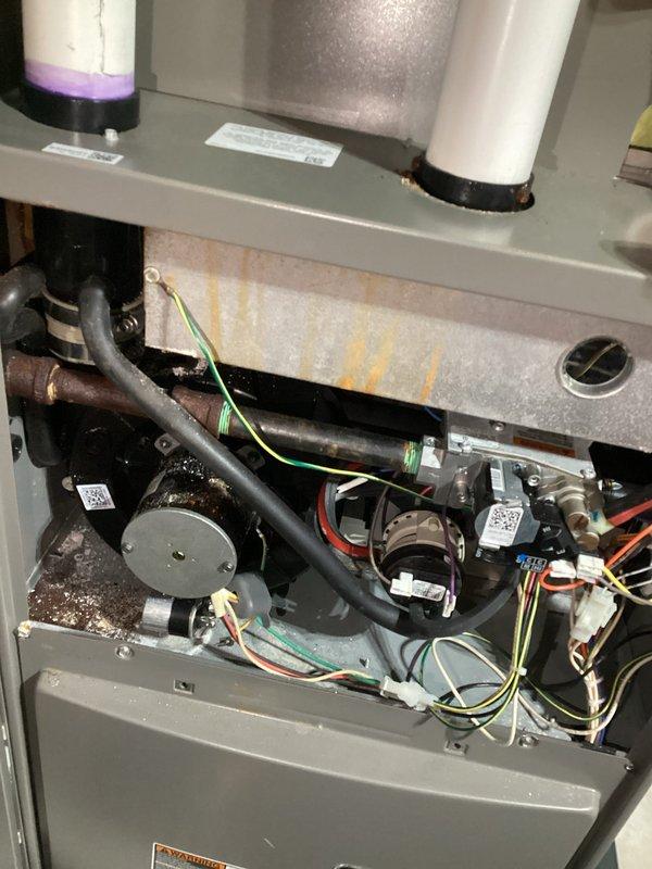 Performed annual heating service on a 3-year-old Lennox system. Observed corrosion at the condensate drain connection with visible rust deposits around the rubber gasket. Completed standard furnace tune-up; system is now operating within normal parameters.