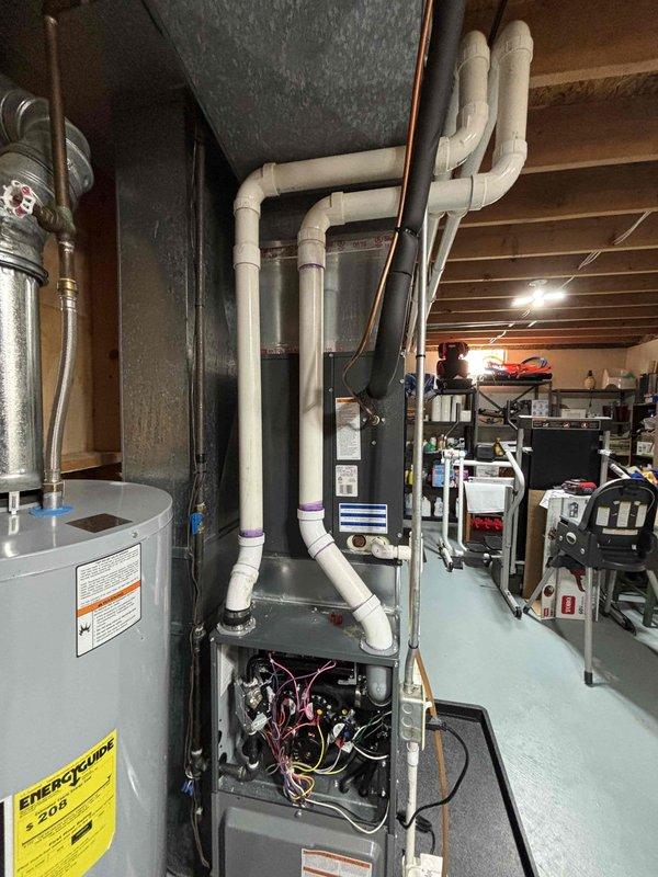 Completed complimentary annual heating maintenance on 1.5-year-old Daiken furnace system. Performed comprehensive tune-up with all components functioning properly; system is in excellent working condition with no issues identified. Documented installation with photos showing proper ventilation setup and accessible mechanical room configuration.