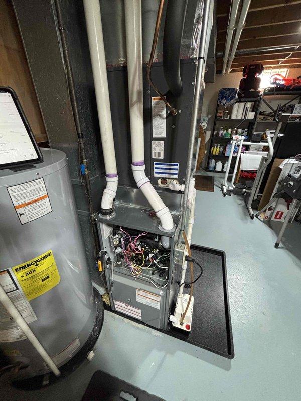 Completed complimentary annual heating maintenance on 1.5-year-old Daiken furnace system. Performed comprehensive tune-up with all components functioning properly; system is in excellent working condition with no issues identified. Documented installation with photos showing proper ventilation setup and accessible mechanical room configuration.