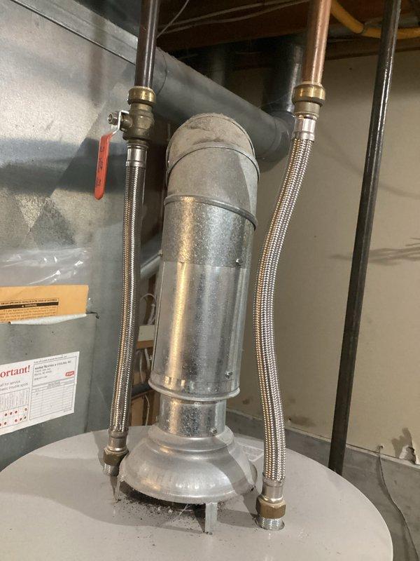 Performed inspection of a 2009 40-gallon gas water heater with recurring pilot light failure issues. Examined the existing ventilation system, which includes galvanized steel ductwork, flexible stainless steel water lines, and brass fittings. Provided customer with replacement options for complete tank installation and removal of the aging unit.