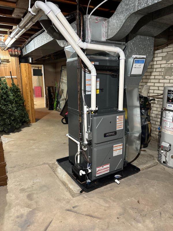 Successfully completed installation of new furnace and air conditioning system as scheduled. Installed furnace unit on platform with proper PVC venting and connected to existing ductwork in utility area. Mounted AC condensing unit on concrete pad with appropriate refrigerant line connections and drainage setup.